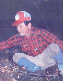 A researcher of historic trails has to hack down the awns andbushes that cover trail subgrades before he or she conducts anymeasuring and takes photographs .