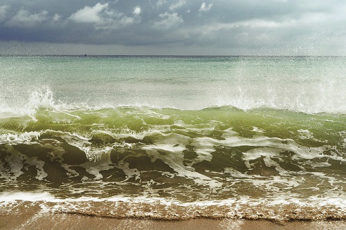 Longshore drift is the movement of sediments such as clay and sand along a coast affected by factors including waves, currents, or tides. / Szu-Chi Hsu