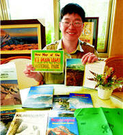 Piles of books, postcards and maps are Chiang's favorite souvenirs