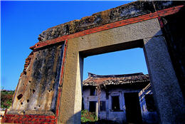 The half–collapsed Beishan Western Style House with countless bullet holes in it