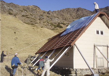 Park rangers repair mountain cabins, set up road signs, remove fallen tress, set up aluminum ladders, and clear paths./ by Buya