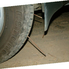 Pictures show that the route of police's patrol car had been put nails that caused serious blowouts of the tires. / Photo provided by Zai-quan Xiao